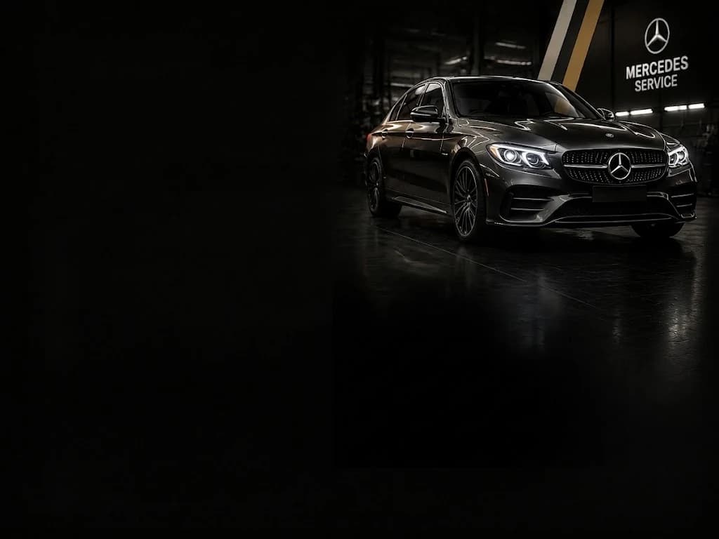 Mercedes C-Class in a dark Mercedes service workshop
